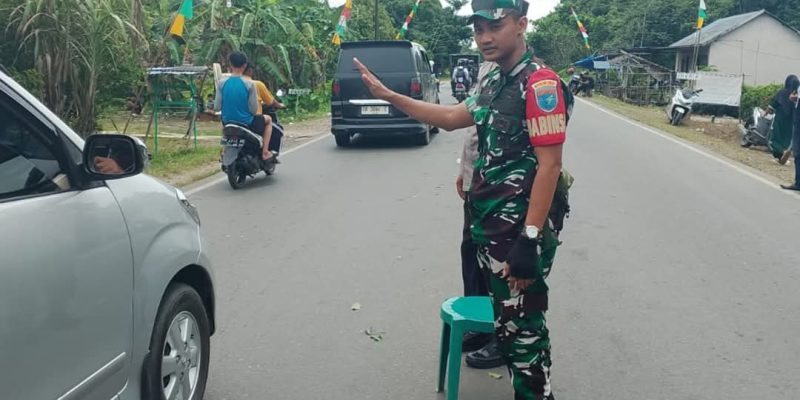 Dukung Kelancaran Jamaah Haul Guru Sekumpul Personel Kodim 1011/Klk Amankan Mobilitas Jemaah Haul Guru Sekumpul
